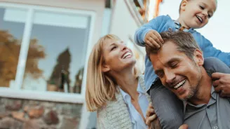Mother, Father and Child Playing Outdoors