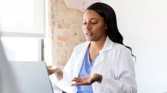 A doctor engaged in a virtual conversation