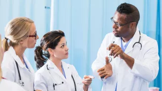 Group of Medical Residents Talking to Each Other