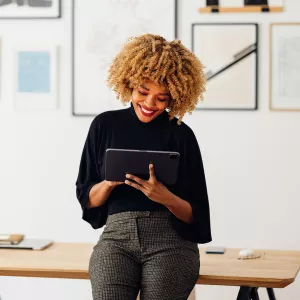 A African American woman using a tablet at her office