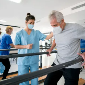 Nurse Helping Patient with Rehabilitation Exercise