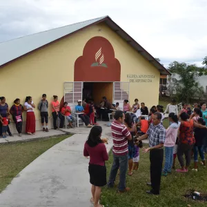 A line of people waiting to be served by the clinical team