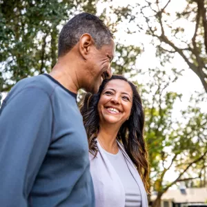 Couple walking outdoors in park