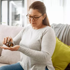A woman taking her medication.