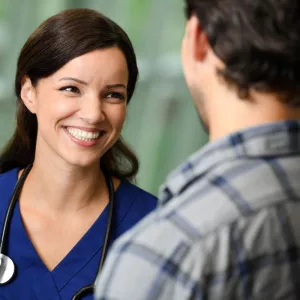 nurse with patient talking