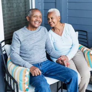 Senior couple relaxing on porch outdoors