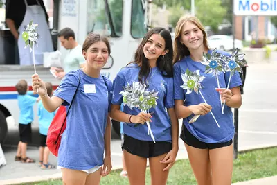 Three teen girls at junior board event