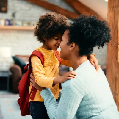 A Mother is Nose to Nose with Her Daughter Just as She's About to Leave For School