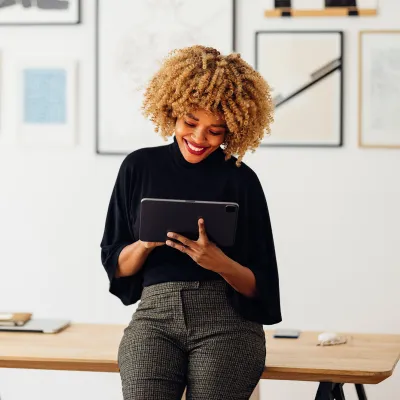 A African American woman using a tablet at her office