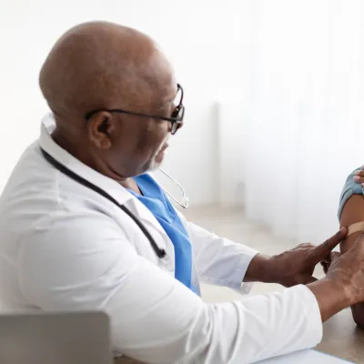 A Doctor Put on a Bandage After Giving an Injection