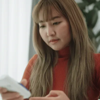 A Woman Checks Her Glucose Monitor