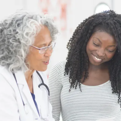 Female Patient Listening to Female Doctor