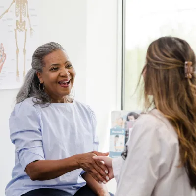A Patient Greets a Provider in an Exam Room