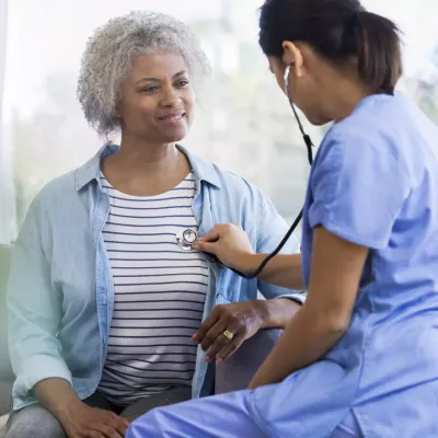 Physician Checking Patient's Heart