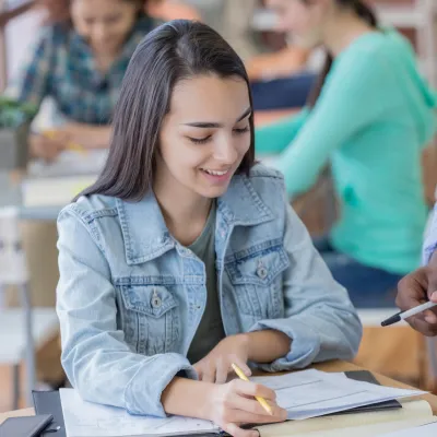 Girl Asking Teacher a Question