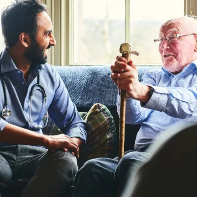 Doctor visiting a senior patient at home.