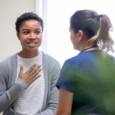 Woman Talking to Doctor About Personal Medical Issue