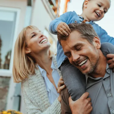 Mother, Father and Child Playing Outdoors