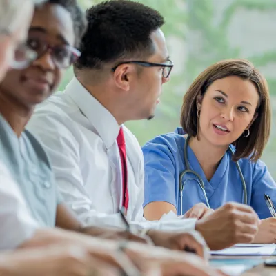 A Resident speaks with Hospital Staff