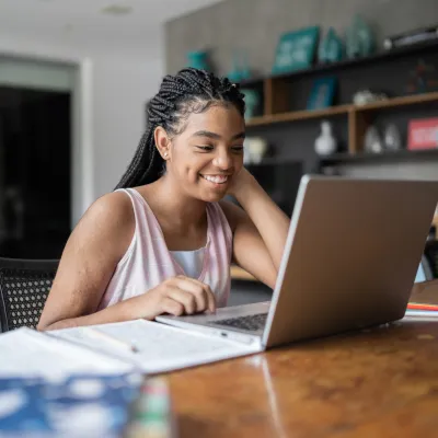 African American Girl Looking at Laptop