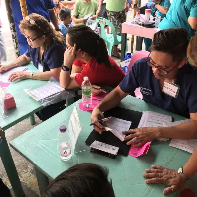 Volunteers helping other people.