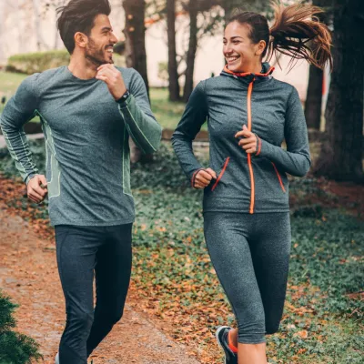 Two Friends Jogging in Park