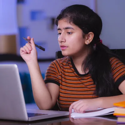A teenager using her computer.