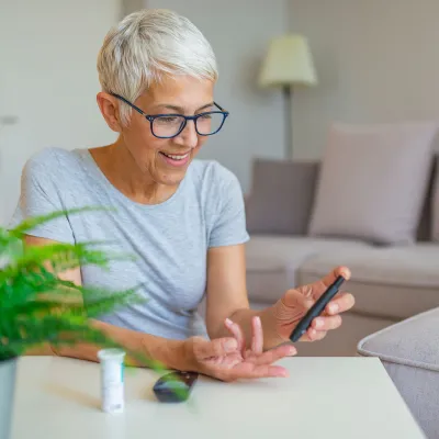 Woman checking blood sugar.