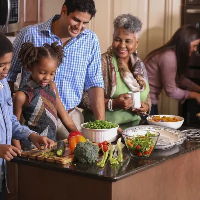 Family cooking meal in the kitchen for holiday