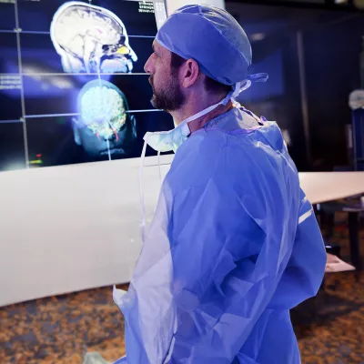 Physician looking at brain scans