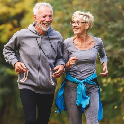 Older Couple Running in Park