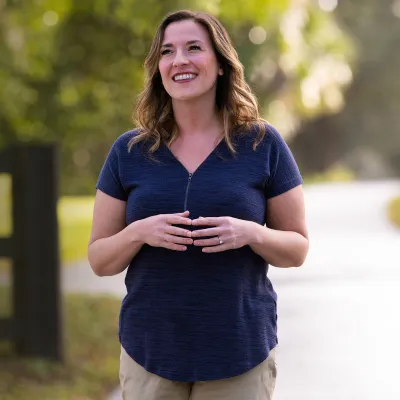 happy woman walking outside