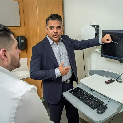 Doctor Showing Patient their Spine Image