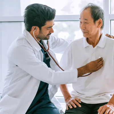 Physician Checking Patient Heart