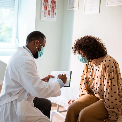 Provider and patient in an office looking at test results