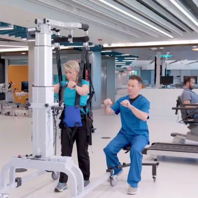 A Therapist Helps a Patient Through a Physical Therapy Session.