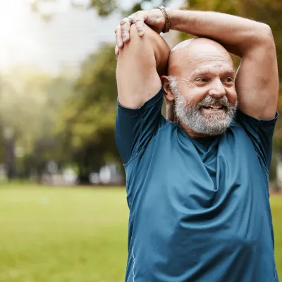 Senior Man Stretching Outdoors