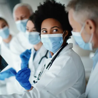 Doctors reviewing scans for patient with other doctors