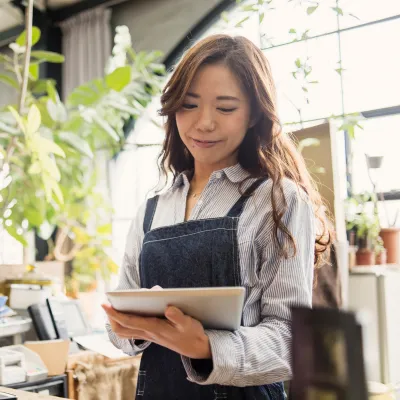 Young Adult Girl Working in Plant Nursery