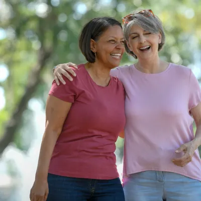 Two women jogging in park