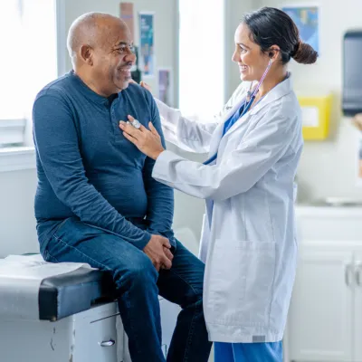 Older male patient with his primary care provider.