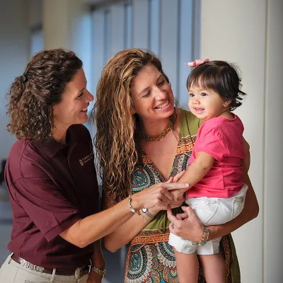 Volunteer playing with child