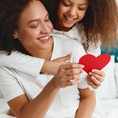 Woman and daughter with heart