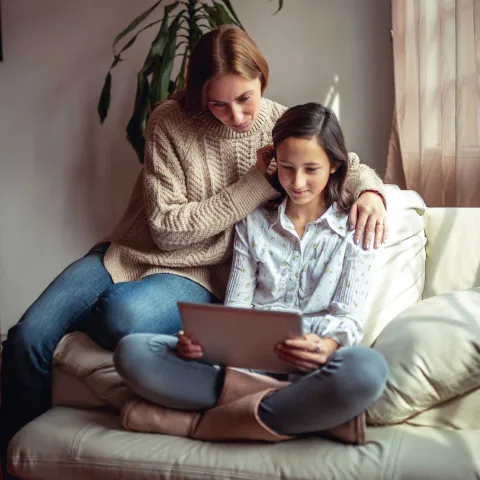 Teen Girl with Mom Filling Out Form