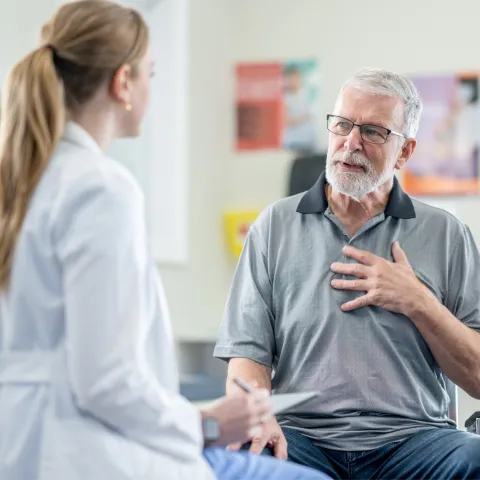 A Senior Patient Speaks to His Physician is an Exam Room