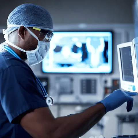 Heart Surgeon in Surgery Room Examining Screen