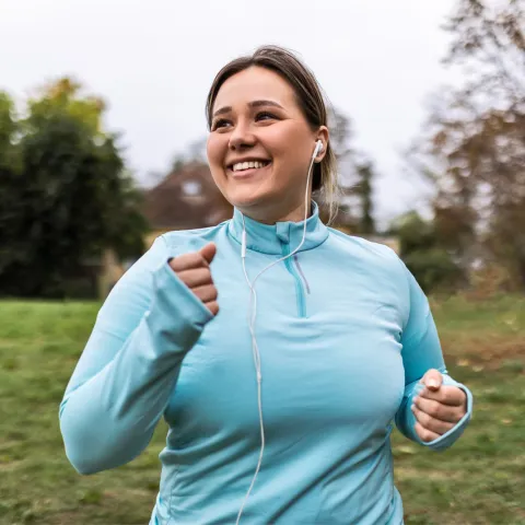 Woman running in park.