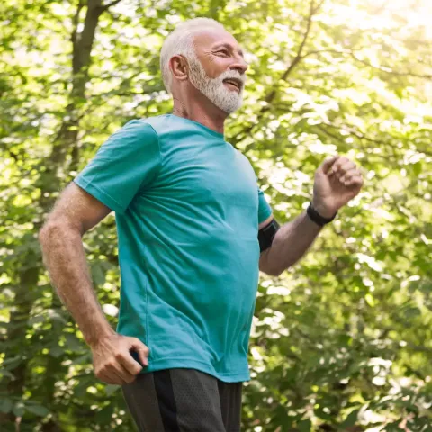 Senior Man Jogging in Park