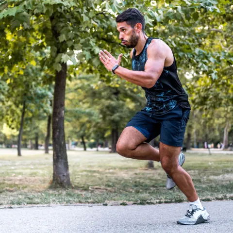 Man running on trail at park.