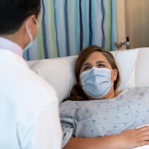 Woman with Doctor After Surgery